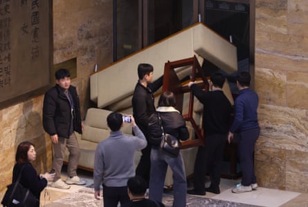 Members of the then opposition Democratic party set up barricades at a entrance of the National Assembly building on 4 December 2024 following the martial law declaration.