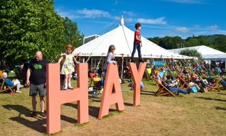 Visitors young and old on a sunny day at the Hay festival.