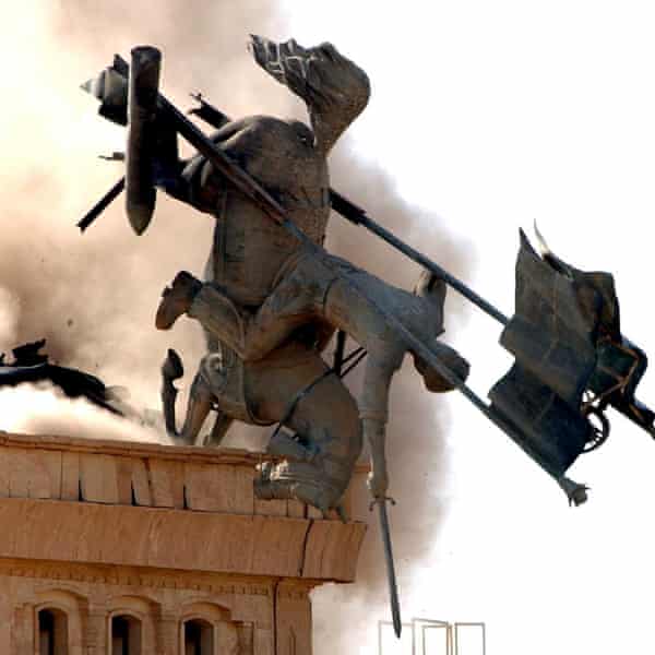 A statue of Saddam Hussein being destoyed by US forces in Tikrit in July 2003.