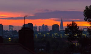 The sun rises over the City of London
