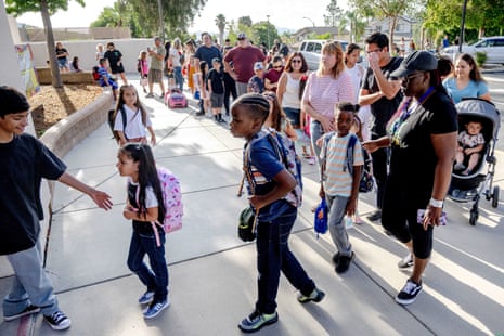 Students and parents move in line