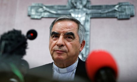 Cardinal Angelo Becciu speaks to the media in Rome.