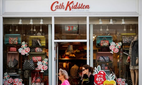 People walk past a Cath Kidston store in London.