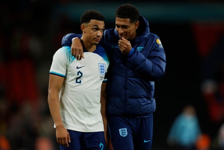 Trent Alexander-Arnold chats with England teammate Jude Bellingham at Wembley last month.
