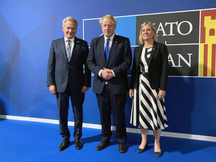 Boris Johnson (centre) with the Swedish prime minister Magdalena Andersson and the Finnish president Sauli Niinisto (left) ahead of a meeting during the Nato summit today.