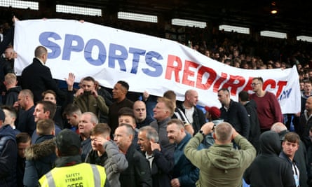 Newcastle fans hold up a banner in protest at Mike Ashley, who attended the game at Selhurst Park.
