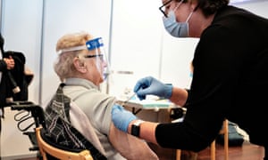 A woman receives the coronavirus vaccine in Aalborg, Denmark, on Monday