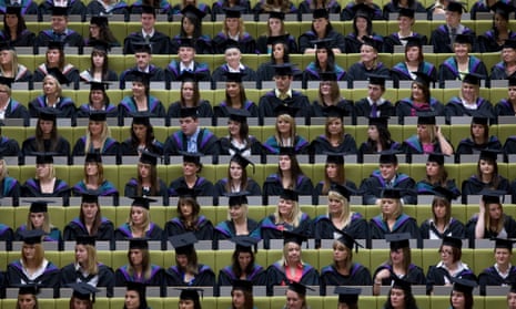 Students attend a graduation at a ceremony