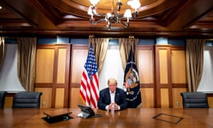 This handout photo released by the White House shows US President Donald Trump and his Chief of Staff (not pictured) participating in a phone call with the US Vice President, Secretary of State and Chairman of the Joint Chiefs of Staff on 4 October 2020, in his conference room at Walter Reed National Military Medical Center in Bethesda, Maryland.