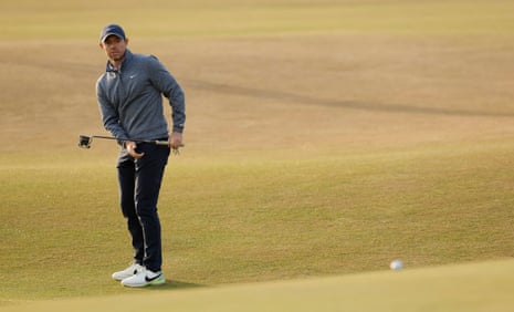 Rory McIlroy putts on the the 18th.