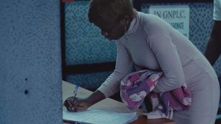 A worker signs in in Ayo Akingbade’s The Fist (2022), 