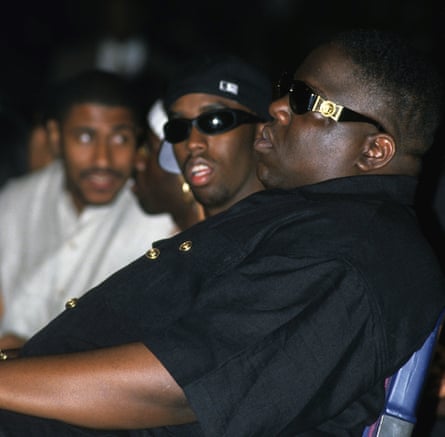 Sean ‘Diddy’ Combs (left) and Christopher ‘The Notorious B.I.G.’ Wallace sitting in a venue