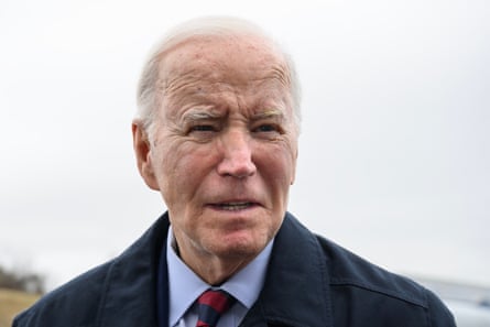 a man in a suit and coat speaks