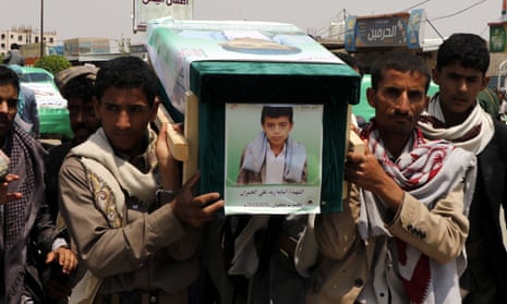 Mourners carry the coffin of a child at the funeral procession for those killed in an airstrike on a bus in Yemen.