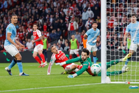 Arsenal’s Leandro Trossard watches as the ball hits the post late on