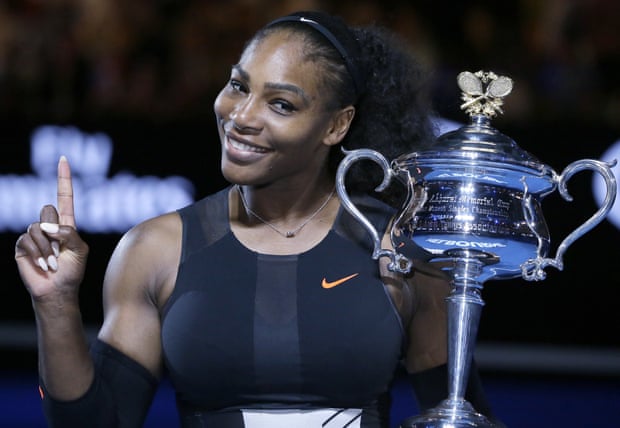 Serena Williams celebrates with the Australian Open trophy 