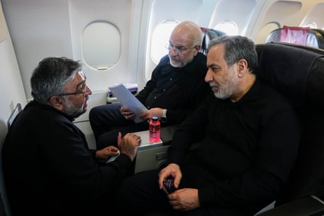 Top negotiator Mohammad Bagher Qalibaf (centre), foreign minister Abbas Araghchi (right) listen to Abolfazl Amouei, international affairs assistant of Qalibaf, on their flight to Switzerland to attend their talks with the US delegation.