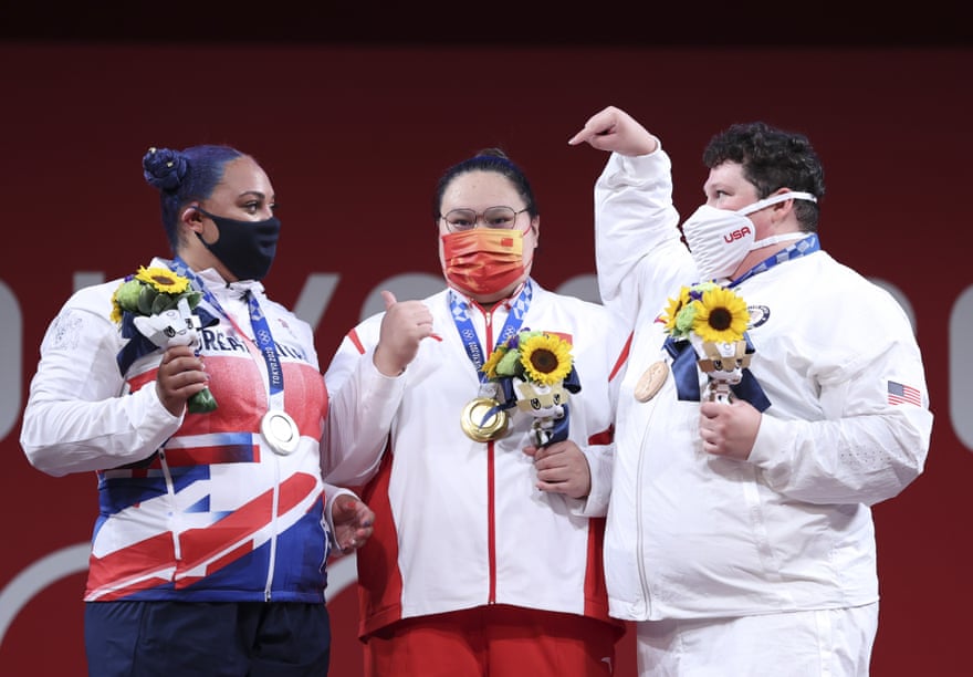 Emily Campbell of Great Britain, gold medallist Li Wenwen of China and bronze medallist Sarah Robles of the United States on the Olympic podium