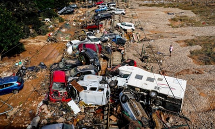 Cars wrecked by the flooding in Valencia.
