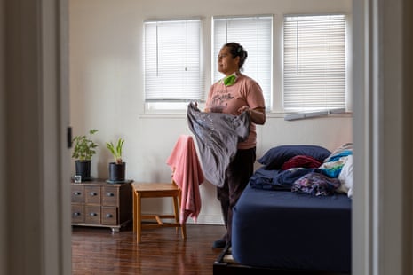 Loa Niumeitolu folds clothes in her bedroom on Friday, 11 December 2020, in Berkeley, California.