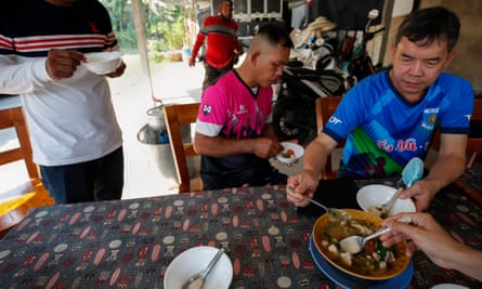 Villagers eat marijuana-infused chicken Tom Yum soup in Nakhon Pathom province, Thailand.
