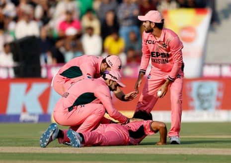 Razaullah celebrates with teammates after taking the wicket of England's Will Jacks.