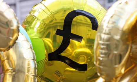 The Bank of England is seen reflected on a balloon during a protest against the hiking of interest rates in August 2023. 