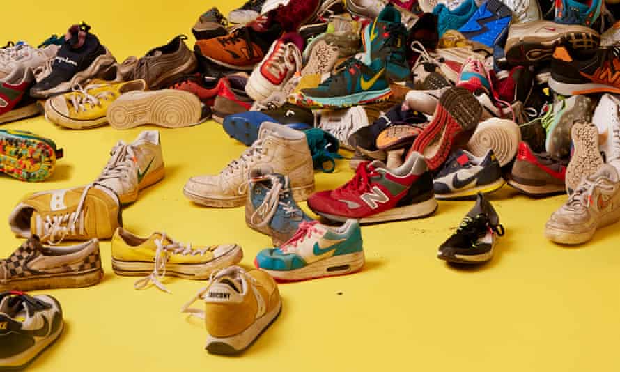 Pile of trainers against yellow background
