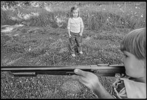 A child learning how to fire a rifle