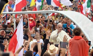 Pope Francis waves to pilgrims at Błonia park in Kraków