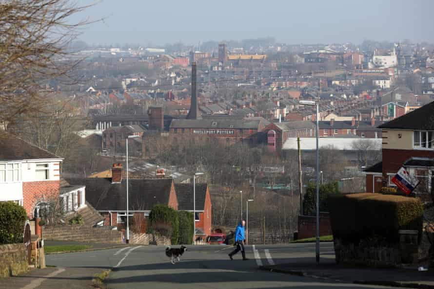 A man walks a dog in Stoke-on-Trent