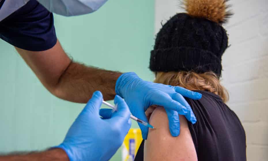 A mobile NHS ‘vaccination on wheels team’ in Windsor. A senior government source says the government were aiming for 2.4m boosters a week to about 3.5m or 500,000 a day.