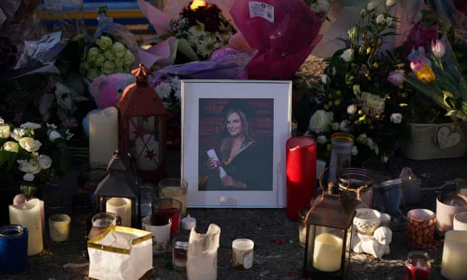 Floral tributes and candles surround a photograph of Ashling Murphy left at the Grand Canal in Tullamore, County Offaly.