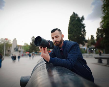 Ismail Abu Hatab holding a camera