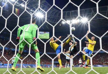 Sweden’s Zlatan Ibrahimovic utilises his long legs to poke the ball past Belgium goalkeeper Thibaut Courtois, left, and into the net but the goal was disallowed.