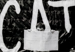 Andrew Lloyd Webber holds up the score of Cats on the roof of his apartment building in New York