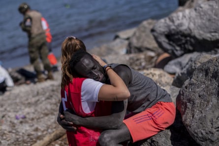 A refugee is comforted in Spain