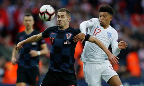 Jadon Sancho tries to win the ball for England