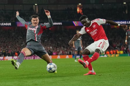 Arsenal’s Bukayo Saka shoots to score his side's second goal against Olympiakos