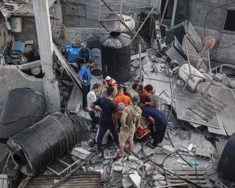 Rescuers among the rubble of buildings