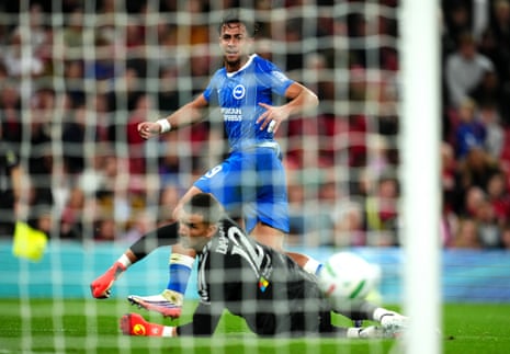 Charalampos Kostoulas tucks the ball home from a tight angle to get Brighton back into the game.