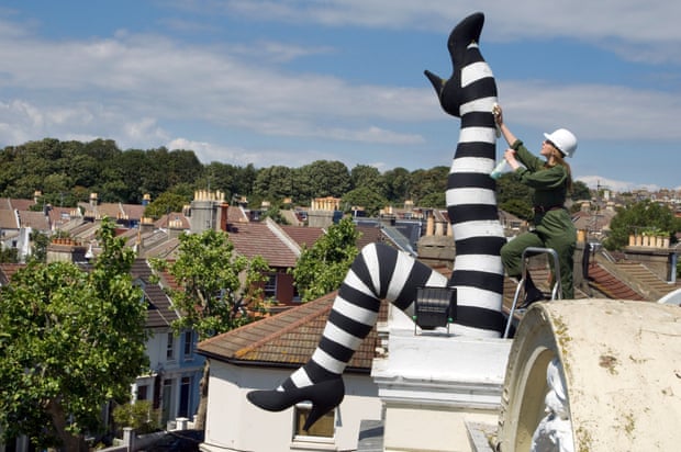 A pair of giant feet on the roof of the Duke of York cinema, Brighton.  Roger Bamber received an honorary master's degree from the University of Brighton for his coverage of the city.