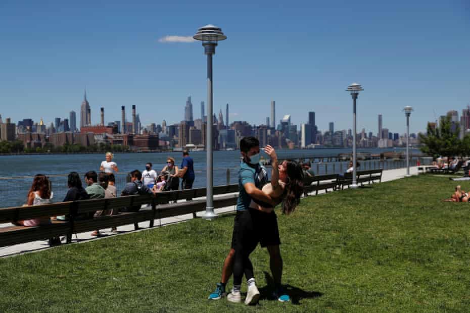 Felipe Beltran, 25, gives a salsa lesson to Brianna Davis, 29, at Domino Park in New York City.
