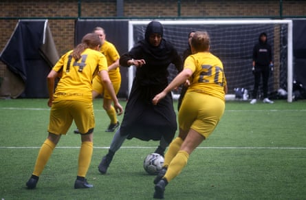 Sisterhood FC member Atiya, 24, plays against Hackney Wick FC during a Ladies Super Liga 5-a-side tournament match, at The Colombo Centre