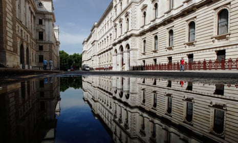 Water pools on the street outside the Foreign and Commonwealth Office in London