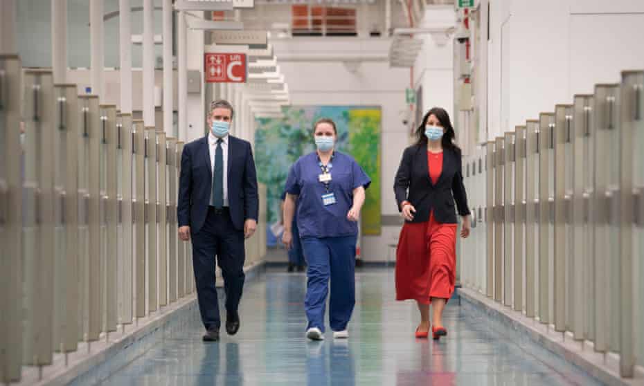 Keir Starmer and Rachel Reeves (right) meet staff at the Chelsea and Westminster Hospital, London, in March 2021.