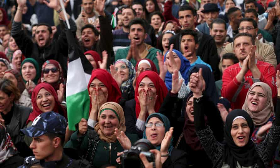 Palestinians celebrate in the West Bank city of Ramallah after primary school teacher Hanan al-Hroub won the Global Teacher prize.