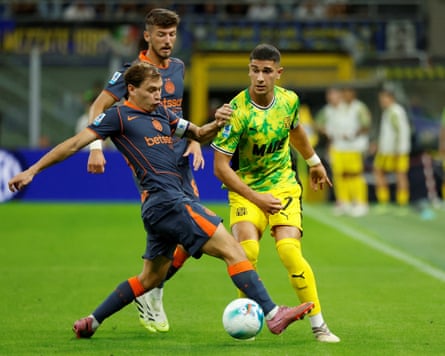 Sassuolo’s Cristian Volpato competes for the ball against Inter Milan’s Nicolo Barella