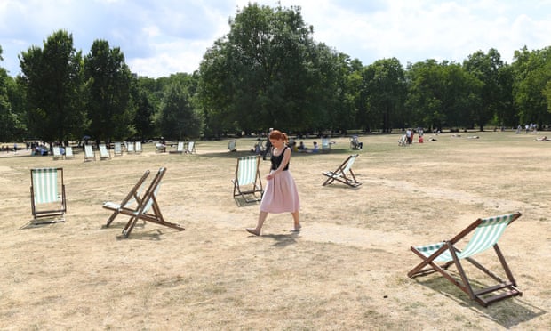 Green Park in London belies its name as extreme heat turns grass brown.