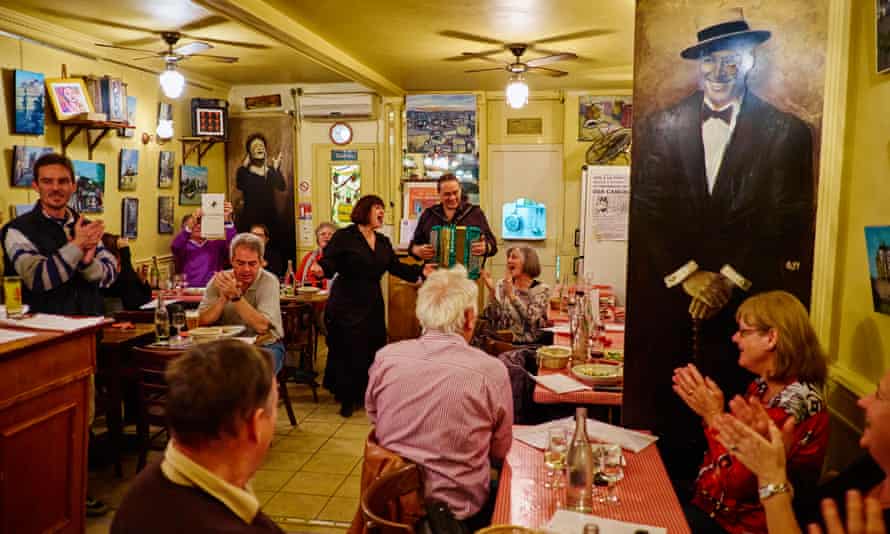 A singer and accordion player entertain guests at Restaurant Le Vieux Belleville, 12 rue Envierges, 75020 Paris, France